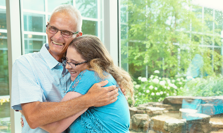 man hugging woman